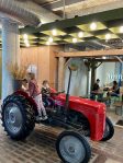 Children play on Tractor inside Made Market - Hamilton East, NZ